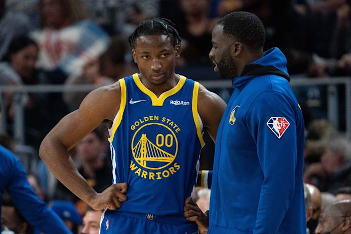 October 30, 2021; San Francisco, California, USA; Golden State Warriors forward Jonathan Kuminga (00) listens to forward Draymond Green (23) during the fourth quarter against the Oklahoma City Thunder at Chase Center. Mandatory Credit: Kyle Terada-USA TODAY Sports